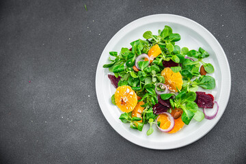 citrus salad, beet, green leaf lettuce fresh healthy eating meal food snack on the table copy space food background top view