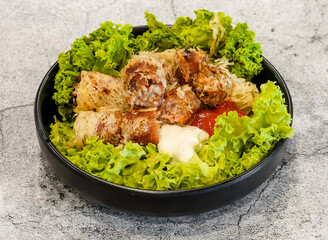 seafood spring rolls or cha gio ghe with lettuce leaf served in dish isolated on grey background...