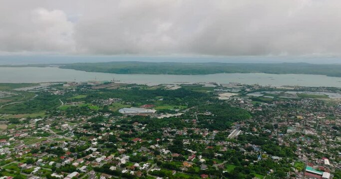 Urban with modern buildings, houses and towers. Panay Island. Philippines.