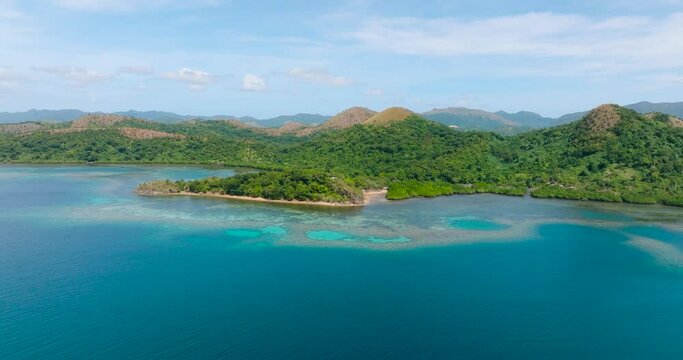 Blue sea around tropical island. Blue sky and clouds. Lajala, Coron. Palawan. Philippines.