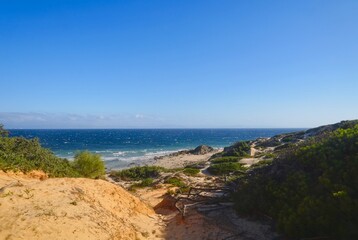Naklejka na ściany i meble view of the beautiful coastline at the Punta Paloma beach with dunes near Valdevaqueros, Tarifa, Andalusia, province of Cádiz, Spain 