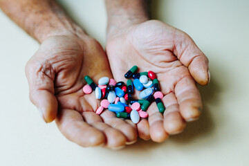 close up Person holds pills in his hands. Health must be maintained.