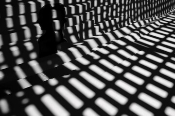 Graphic resources. Abstract black and white shadows mosaic background. Sunlight illuminating room or object through pattern grid makes shadow split in small geometric shape pieces