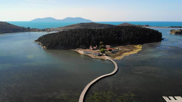 Drone aerial view on isolated Monastery of Saint Mary on Zvernec island Narta Lagoon, Vlore, Albania