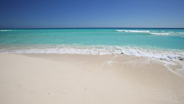 Caribbean Sea beach with white sand and turquoise water, tropical destination. Nobody