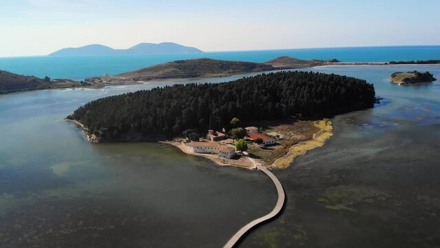 Drone aerial view on isolated Monastery of Saint Mary on Zvernec island Narta Lagoon, Vlore, Albania