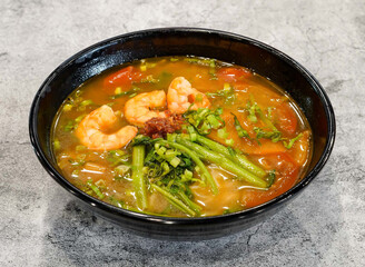 Kien Giang shrimp bun tep soup noodles with spring onion served in dish isolated on grey background top view of singapore seafood