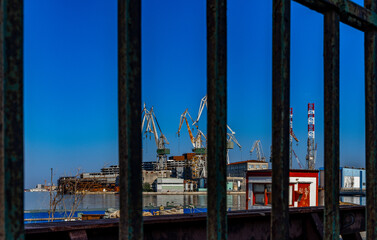 Fototapeta na wymiar Cranes in the port of Pula in Croatia, construction and repair of ships in the port