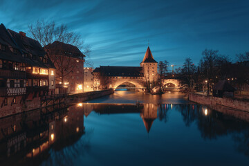 Night view of bridge and beautiful old buildings on the Pegnitz River in Nuremberg. Bavaria Region Middle Franconia, Germany