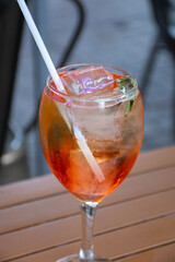 close up of drink glasses with ramazzotti rosato ice on a bistro table in the city center