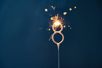 8 years celebration festive background with copy space made with Bengal fire in the form of number...