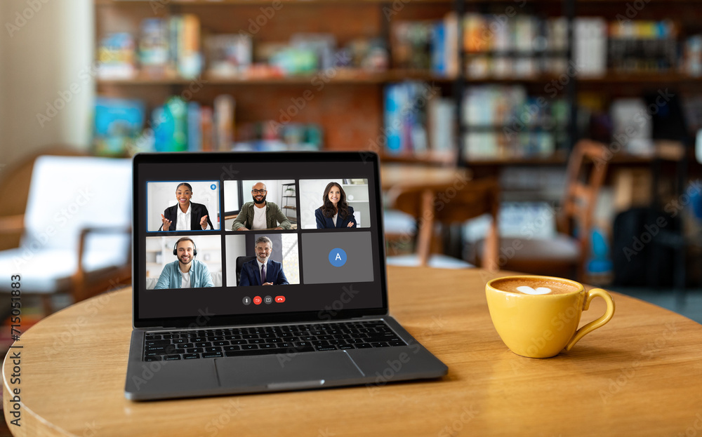 Poster computer with video chat screen on table at cafe