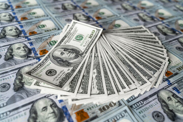 Stack of Hundred Dollar Bills, A Pile of Currency in High Denomination. A substantial and imposing stack of one hundred dollar bills neatly arranged on top of each other.