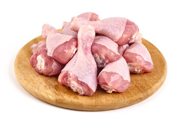 Raw chicken drumsticks, isolated on white background.
