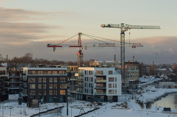 city area and construction cranes