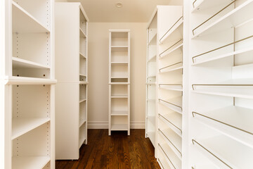Walk in closet with shelves.