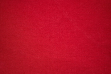 Knitted red background. Knitted knitted fabric is red. Red background - obrazy, fototapety, plakaty