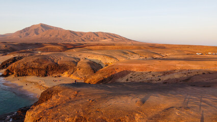 Coastline Atlantik Ocean view from above. Sunset above Mountain and Ocean. Canary Islands. Lanzarote 