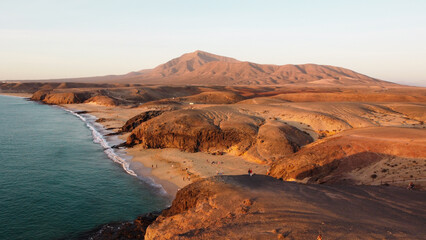 Coastline Atlantik Ocean view from above. Sunset above Mountain and Ocean. Canary Islands. Lanzarote 