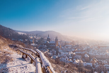 panorama of the city in the cold winter morning with snow and sunlight over head from the balcony near the mountain in Germany