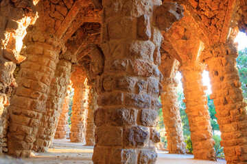 Columns designed by Antoni Gaudi in park Guell in Barcelona, Spain - obrazy, fototapety, plakaty