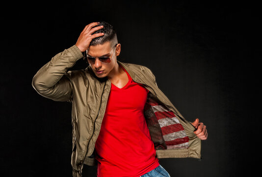 Handsome Young Athletic Male Fashion Model In Jacket With American Flag