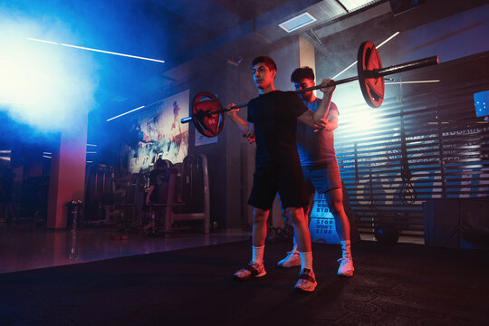 Guided Squat Training in Dynamic Gym Lighting