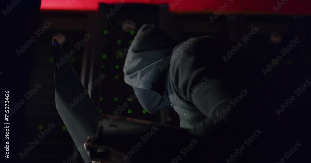 Leinwandbilder Hacker, server room and computer for programming, data center crime or cybersecurity coding of password. Person, thief or programmer in mask and hoodie on laptop, firewall or hacking in dark or night