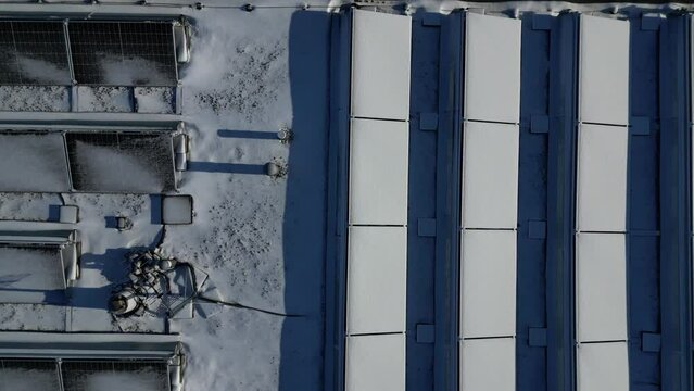 water heating in collectors on gable and flat roofs work when sun is shining. frost covered with layer of snow or frost must be plastered, otherwise effectiveness will recuced in row white silhoulette