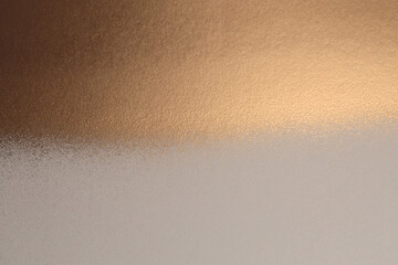 Gold and bronze glitter color spray grain painting texture paper background.