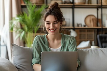 Fototapeta premium Beautiful woman using digital tablet and smiling while sitting at her working place in office