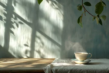Tuinposter A steaming cup of tea on a table with shadows from a window. With copy space. Concept of tranquility, calmness, morning routine, and natural ambiance. © Jafree