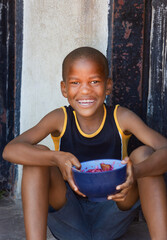 hungry african child, charity and volunteers feeding the hungry