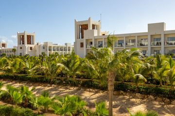 Fototapeta na wymiar Exotic holiday resort in Cape Verde with palm trees and blue sky