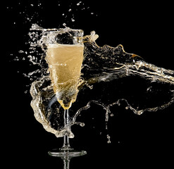 Champagne glass splash on black background - 715095287