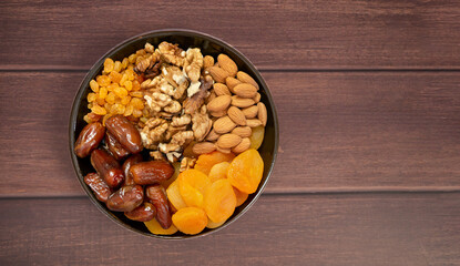 Nuts and dried fruits. Walnuts, almonds, dried apricots, raisins and dates. Healthy food and...