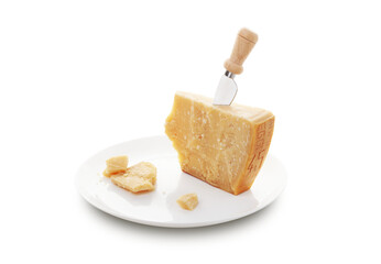 Aged parmesan cheese or parmigiano reggiano and a knife with a wooden handle for cheese on a white plate
