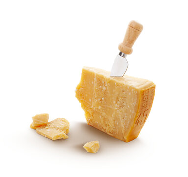 Aged parmesan cheese or parmigiano reggiano and a knife isolated on a transparent background