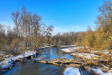 River floodplain delta winter snow meander drone aerial inland video shot in sandy sand alluvium freezing cold frost, benches forest and lowlands wetland swamp, quadcopter view flying fly flight show