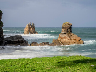 View from Portizuelo beach with whimsical rocks formed by erosion. Luarca, Asturias, Spain