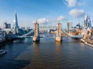Aerial view of the Iconic Tower Bridge connecting Londong with Southwark on the Thames River in London, UK.