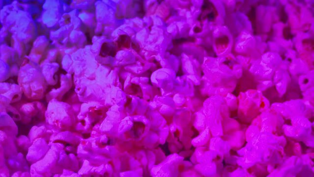 Popcorn In Party Lights Closeup
