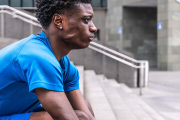 Serene Rest: Black Athlete on Urban Stairs