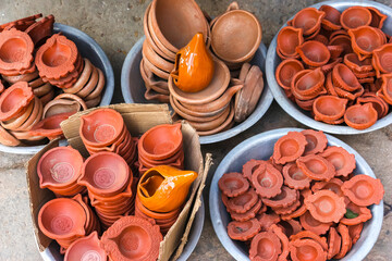Clay lamp stall for festival celebration, Terracotta diyas or oil lamps for Diwali for sale at a...