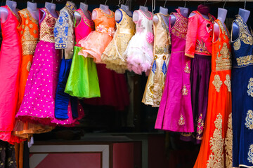Fototapeta na wymiar Puttaparthi, India. Dress for sale at the street shop.