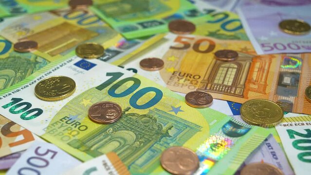 Euro banknotes of various denominations and Euro cents. Real euro banknotes and metal coins of various colors, size and nominals