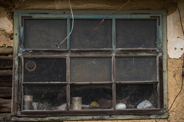 Croatia, October 20,2023 : Rustic style aged window at rural home wall.