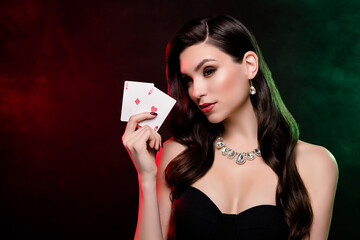 Photo of rich wealthy chic lady in poker club playing show two cards winning over dark background