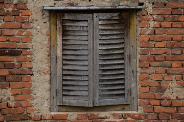 Croatia, October 20,2023 : Rustic style aged window at rural home wall.
