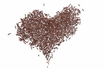 Chocolate sprinkles pile in shape heart, granules isolated on white, top view
